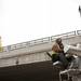 Equipment Operator Mike Reeve uses a crane to install a light post near the East Stadium bridge on Tuesday. Daniel Brenner I AnnArbor.com